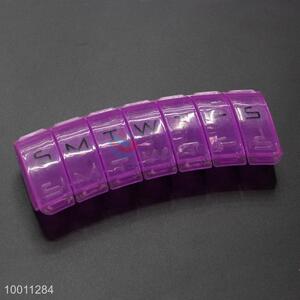Purple plastic 7-grid patient <em>pill</em> <em>box</em>