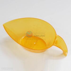 Orange plastic measuring glass with handle