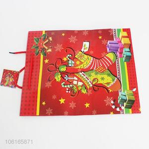 The fashion design paper christmas red gift bag