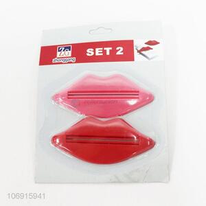 Premium quality 2pcs lip shapes popular plastic toothpaste dispenser