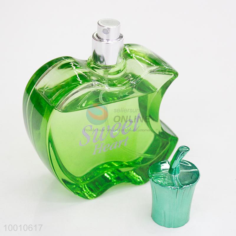 perfume in a green apple shaped bottle