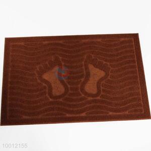 Brown door mat with foor pattern