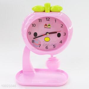 Pink Swinging Alarm Clock Shaped in Apple, Used in Bedroom