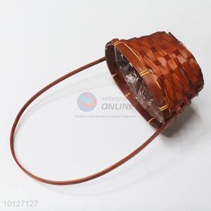 Woven bamboo gift basket with handle
