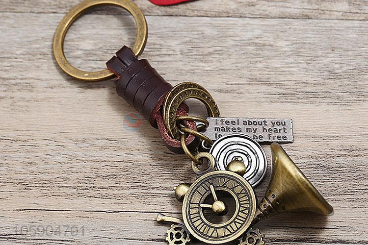 Bottom price weave leather key chain with retro alloy charms
