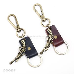 Factory wholesale leather key chain with retro pistol charms