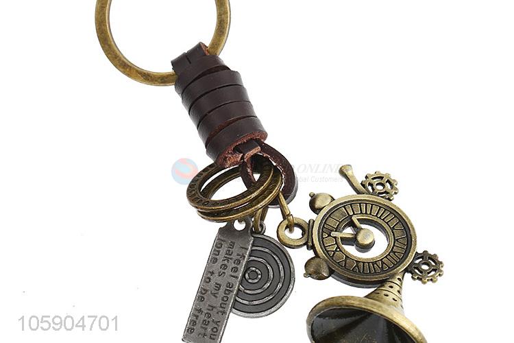 Bottom price weave leather key chain with retro alloy charms