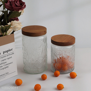 Wholesale clear flower embossed glass <em>storage</em> jar with airtight wooden lid